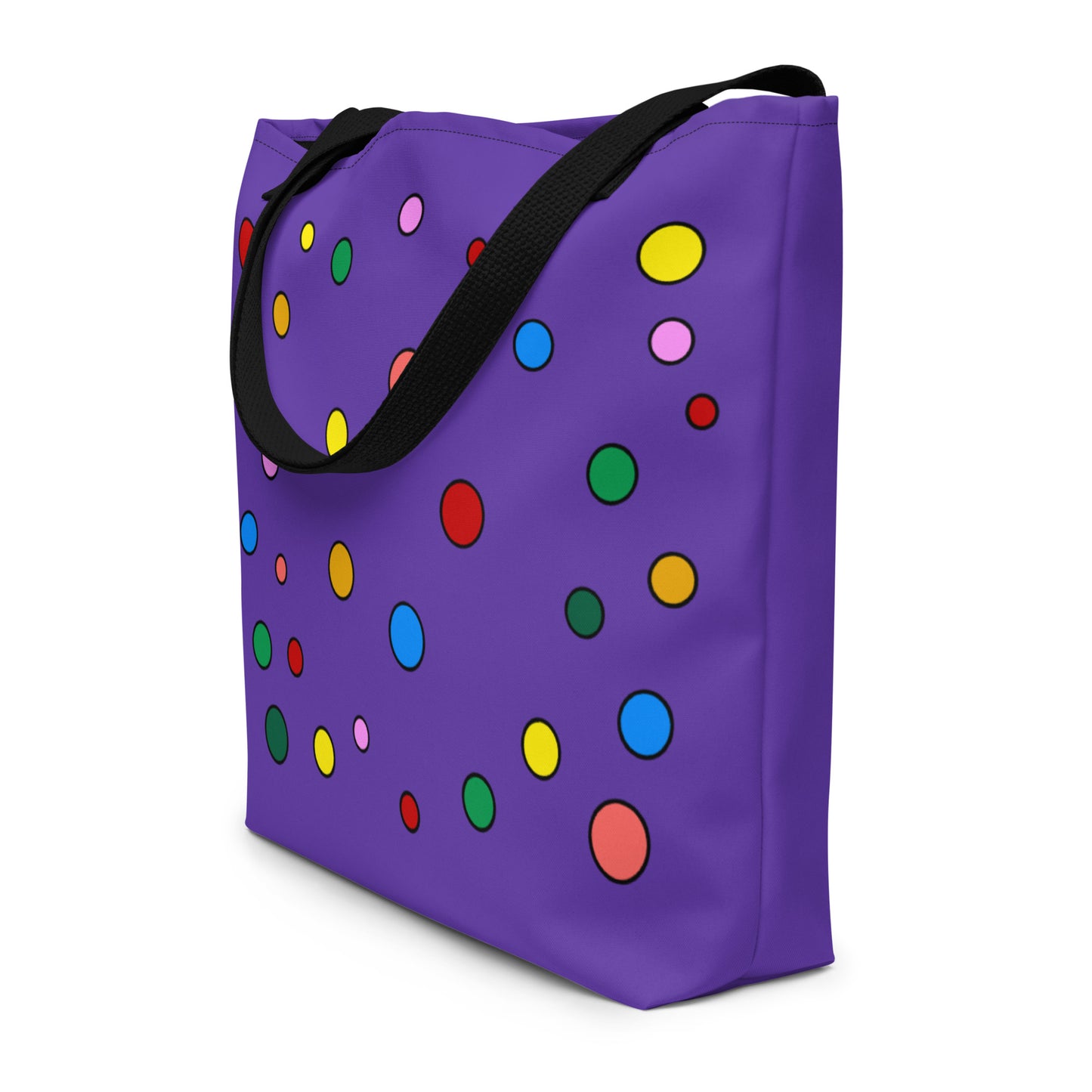 vibrant, colorful purple tote bag with multicolored polka dot design and black cotton handles.