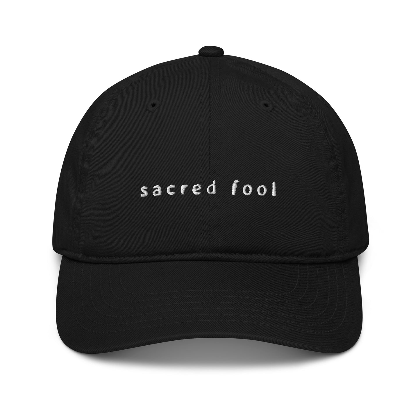 black organic cotton hat with white embroidered logo that reads SACRED FOOL in lowercase averia gruesa libre font